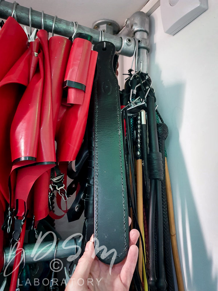 Leather paddle and various BDSM kit