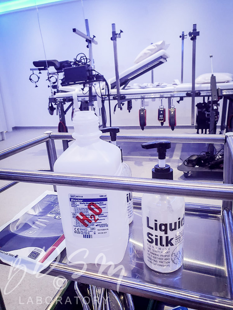 Bottle of Liquid Silk and H2O water in the BDSM Laboratory