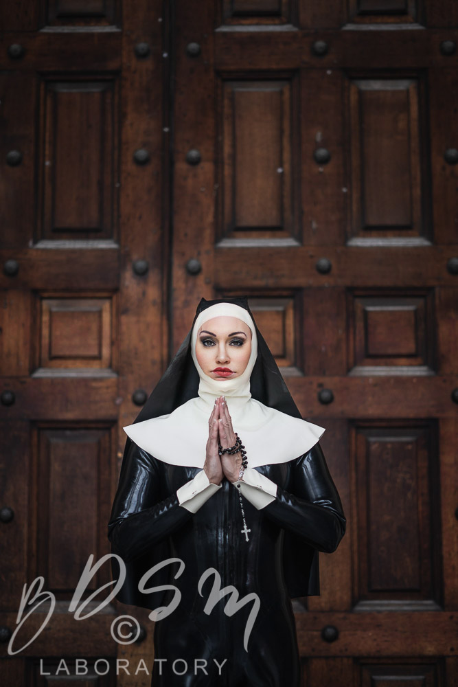 Mistress Miranda dressed in Latex as a Nun outside St Pauls Cathedral