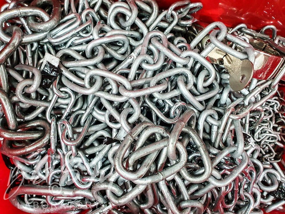 an array of heavy-duty chains, padlocks and keys
