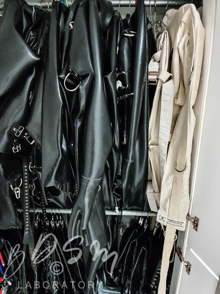 White straight jacket and various rubber and latex outfits