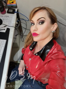 Misress Miranda wearing a red latex top