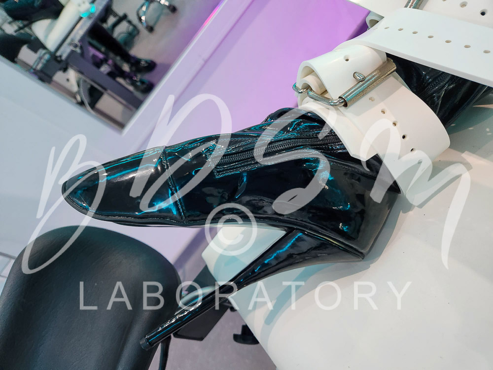 High heel boot and bondage strap