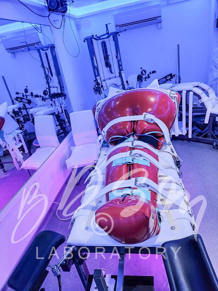 Bondage submissive in rubber
